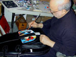 E.J. Gold posing with handpainted Reunion Blues Gig Bag